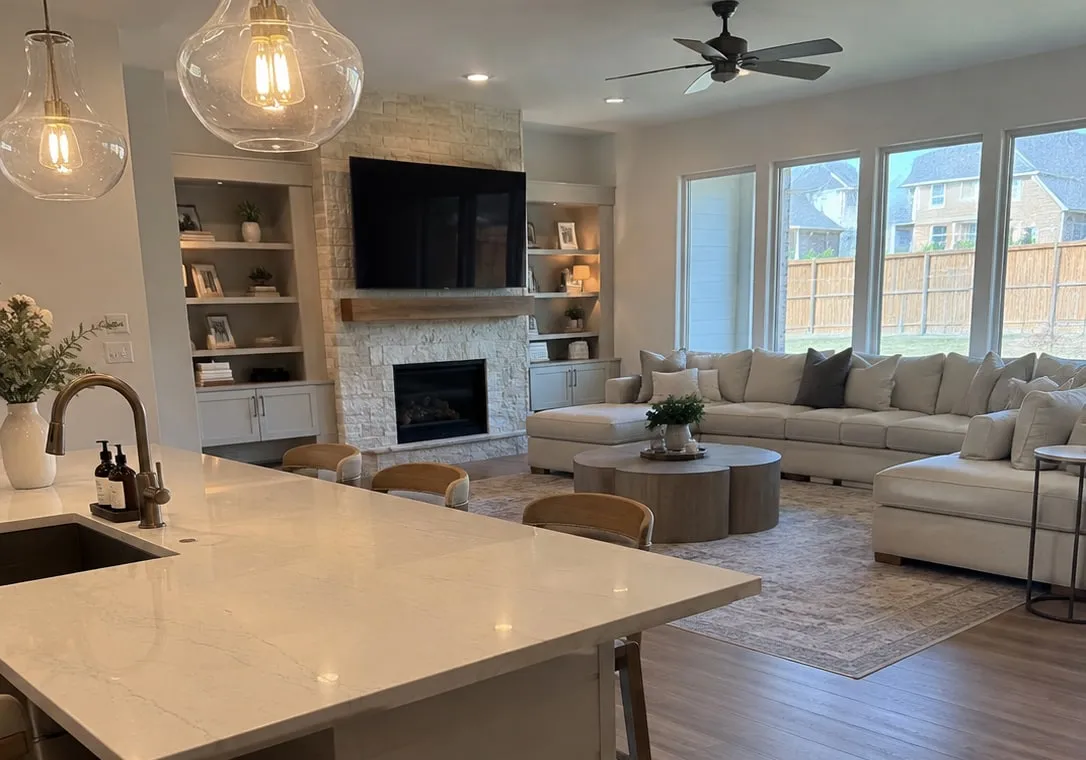 Spotless open-concept kitchen island and living room in a North Texas home after professional house cleaning