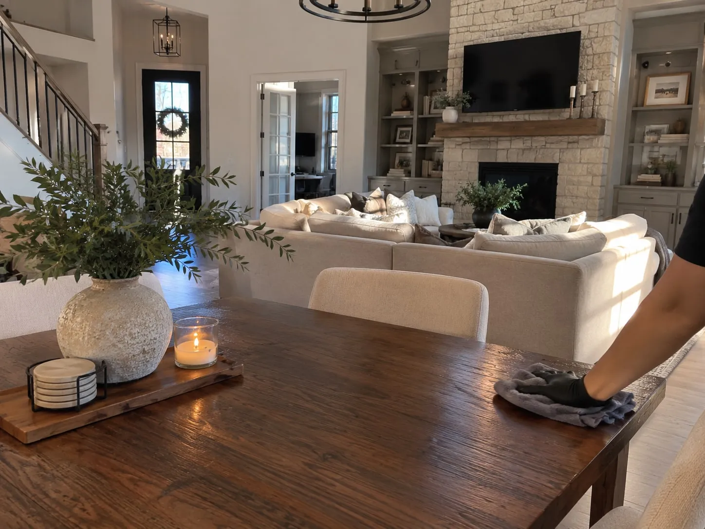 Cleaner wiping a kitchen island during recurring house cleaning in McKinney, TX